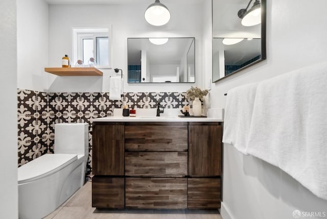 bathroom with tile patterned floors, toilet, and vanity