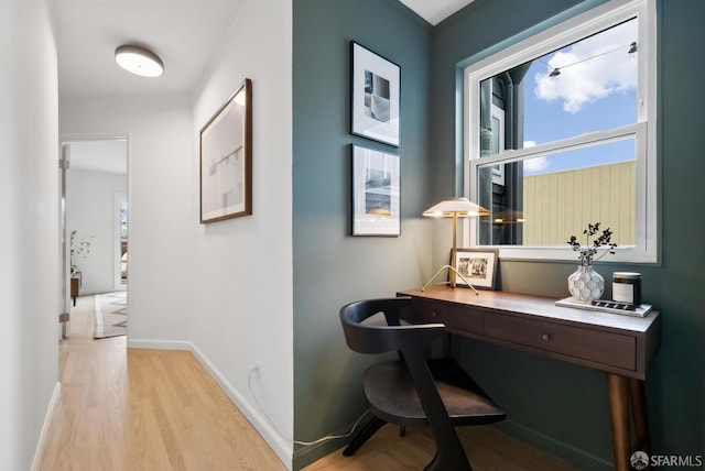 office featuring baseboards and wood finished floors