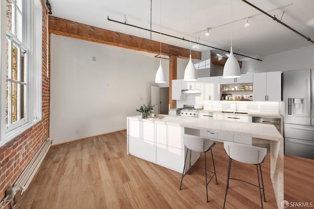461 2nd St Unit 228C, San Francisco, CA 94107 - kitchen with stainless steel refrigerator with ice dispenser, a baseboard radiator, open shelves, brick wall, and a sink