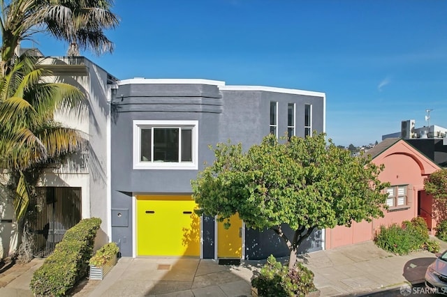 art deco inspired home with stucco siding and central air condition unit