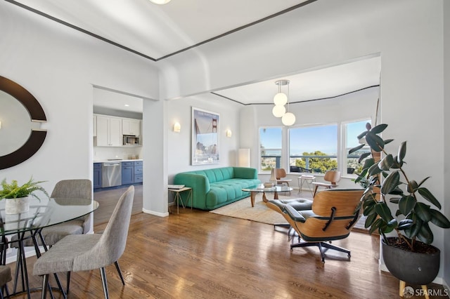 dining space featuring wood finished floors and baseboards