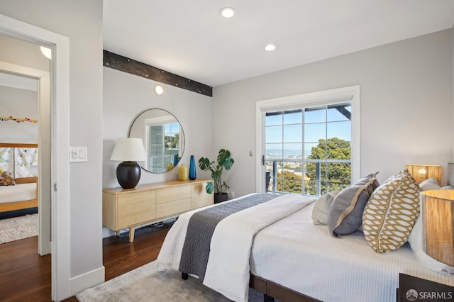 bedroom with wood finished floors, beam ceiling, and recessed lighting