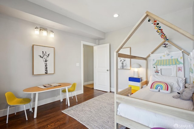 bedroom featuring wood finished floors, baseboards, and recessed lighting