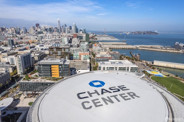 birds eye view of property featuring a view of city and a water view