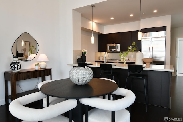 dining space with recessed lighting