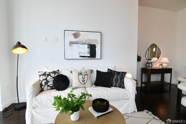 living room with baseboards and wood finished floors