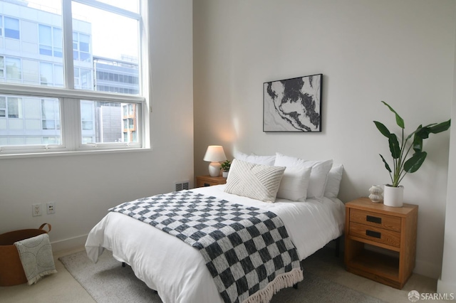 bedroom featuring visible vents