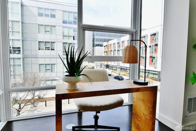 office area featuring baseboards and visible vents