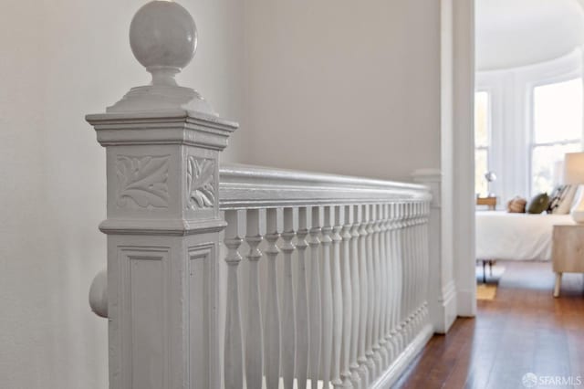 hall with dark hardwood / wood-style flooring