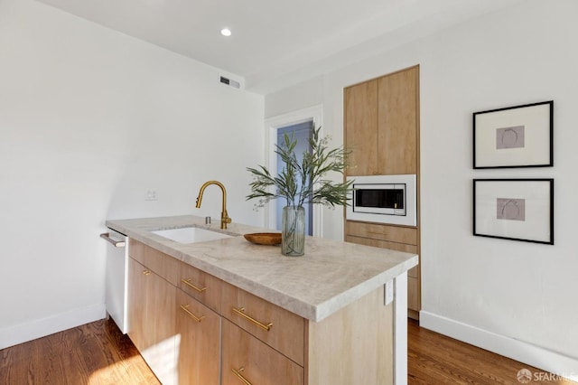 kitchen with dark wood-type flooring, dishwasher, built in microwave, light stone countertops, and sink