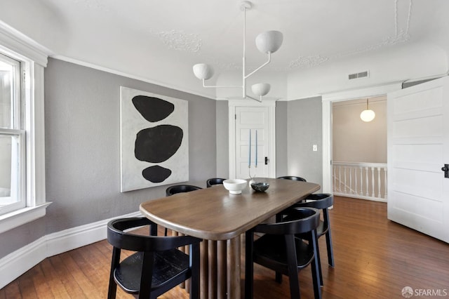 dining room featuring dark hardwood / wood-style flooring