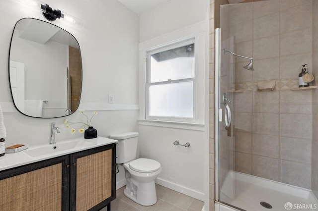 bathroom featuring toilet, tile patterned flooring, an enclosed shower, and vanity