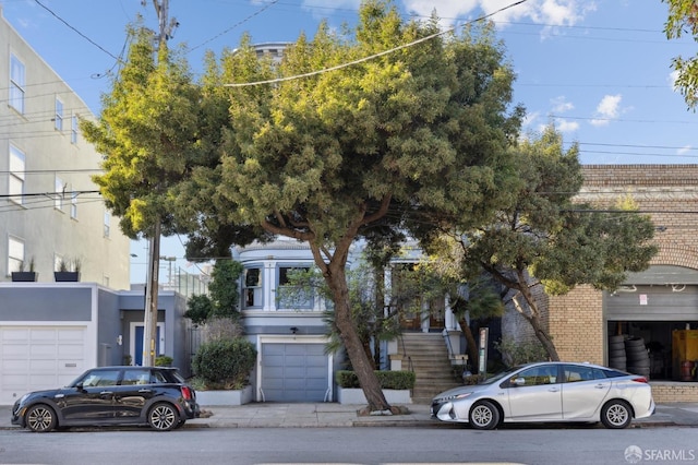 view of property hidden behind natural elements