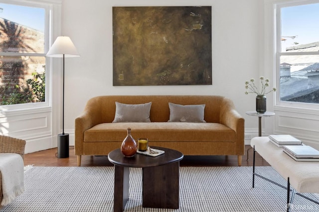 living room featuring plenty of natural light and hardwood / wood-style flooring