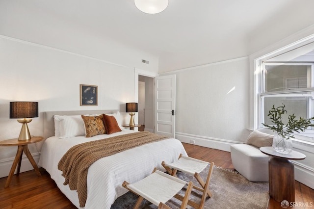 bedroom featuring dark wood-type flooring