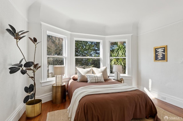 bedroom with hardwood / wood-style floors