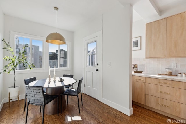 dining area with dark wood-type flooring