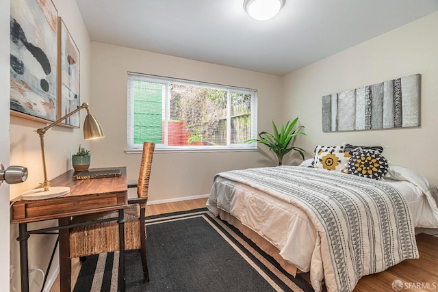 bedroom featuring wood-type flooring