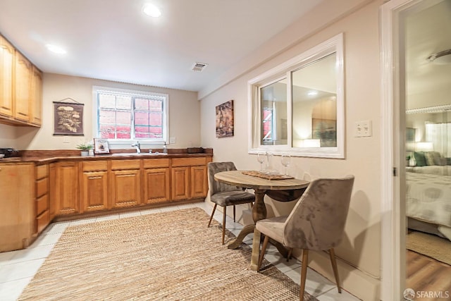 kitchen with sink and light tile patterned floors