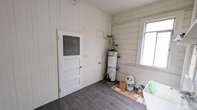 utility room with strapped water heater