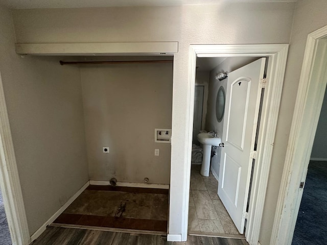 washroom featuring hardwood / wood-style floors, hookup for a washing machine, and hookup for an electric dryer