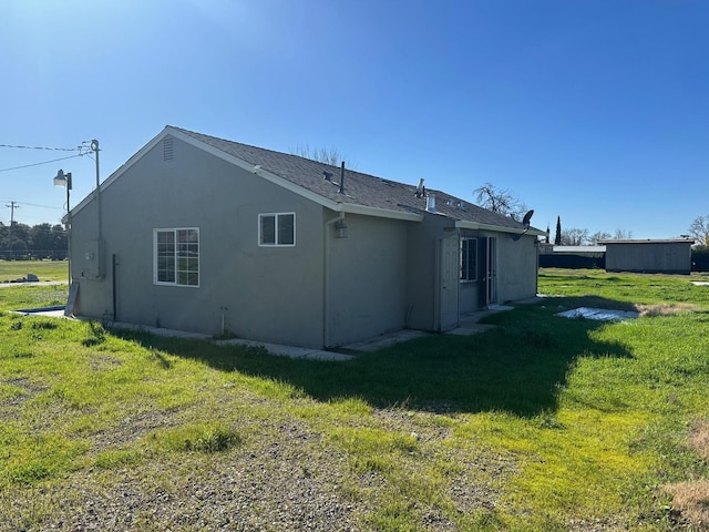 back of house with a yard