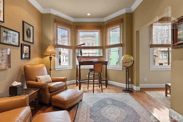 sitting room featuring light hardwood / wood-style flooring and ornamental molding