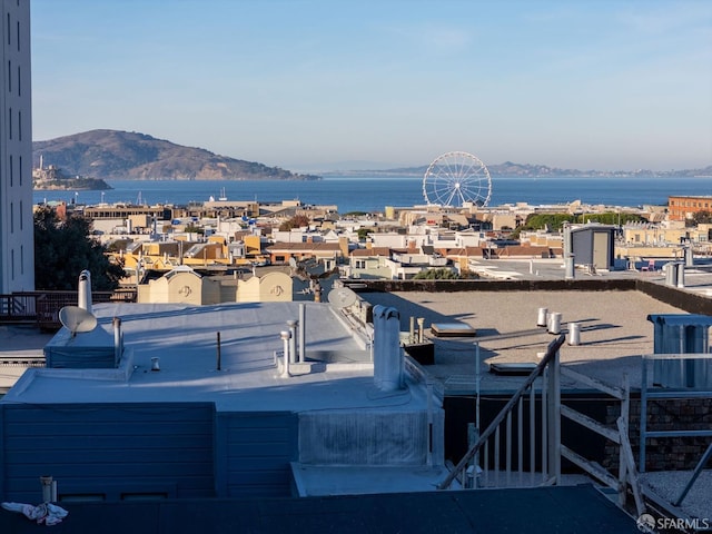 view of patio featuring a water and mountain view