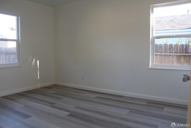 unfurnished room featuring hardwood / wood-style flooring