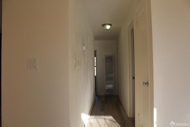 hallway featuring wood-type flooring