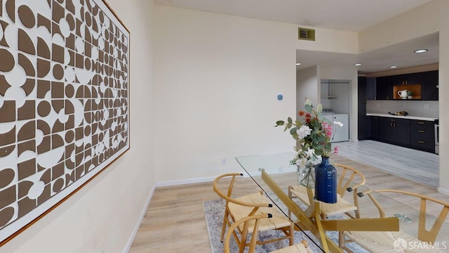 103 Stoneridge Ln Unit 2210, San Francisco, CA 94134 - dining room featuring separate washer and dryer, light wood-style flooring, and recessed lighting