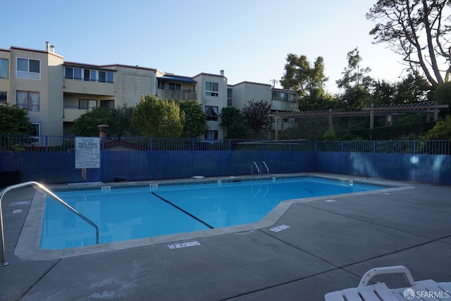 community pool featuring fence