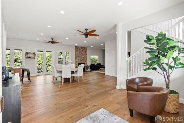 interior space with recessed lighting, stairs, ceiling fan, and light wood finished floors
