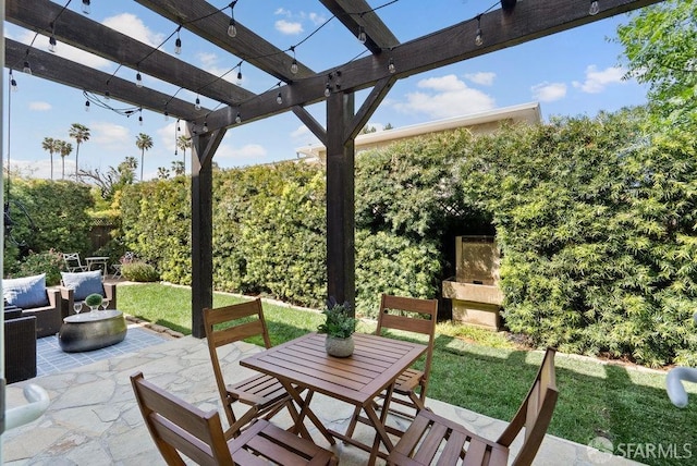view of patio / terrace featuring a pergola and outdoor dining area