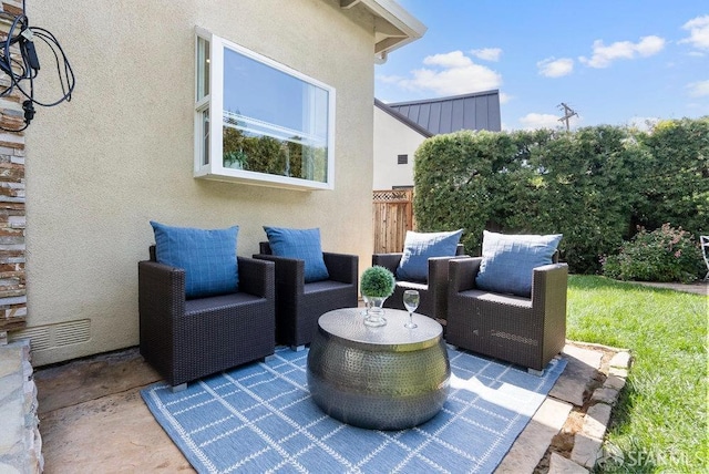 view of patio with an outdoor hangout area and visible vents