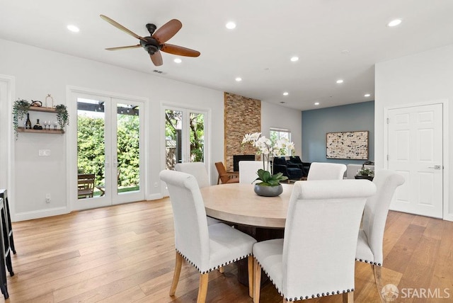 dining space featuring recessed lighting, a ceiling fan, and light wood-style flooring