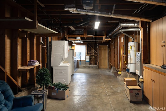 basement featuring wooden walls, white fridge, and gas water heater