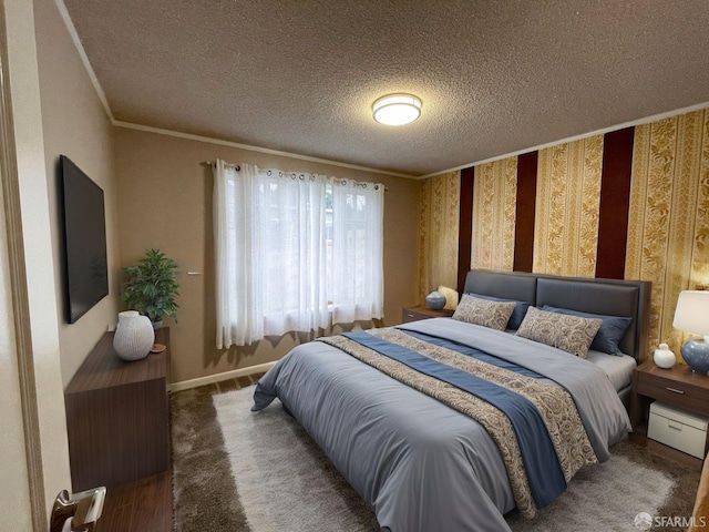 bedroom featuring crown molding and a textured ceiling