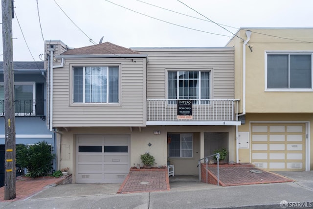 multi unit property featuring a garage