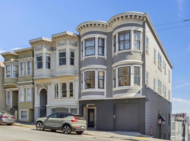 1265 Union St, San Francisco, CA 94109 - view of front of home featuring a garage and brick siding