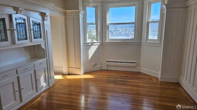 interior space featuring dark hardwood / wood-style floors and baseboard heating