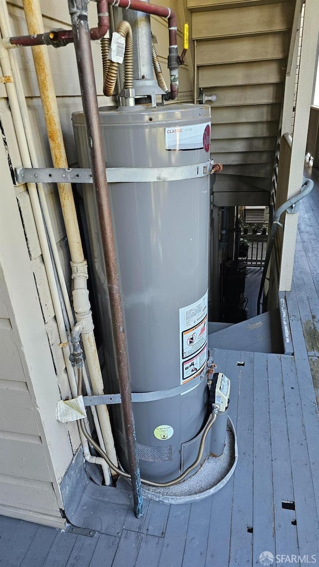 utility room with water heater