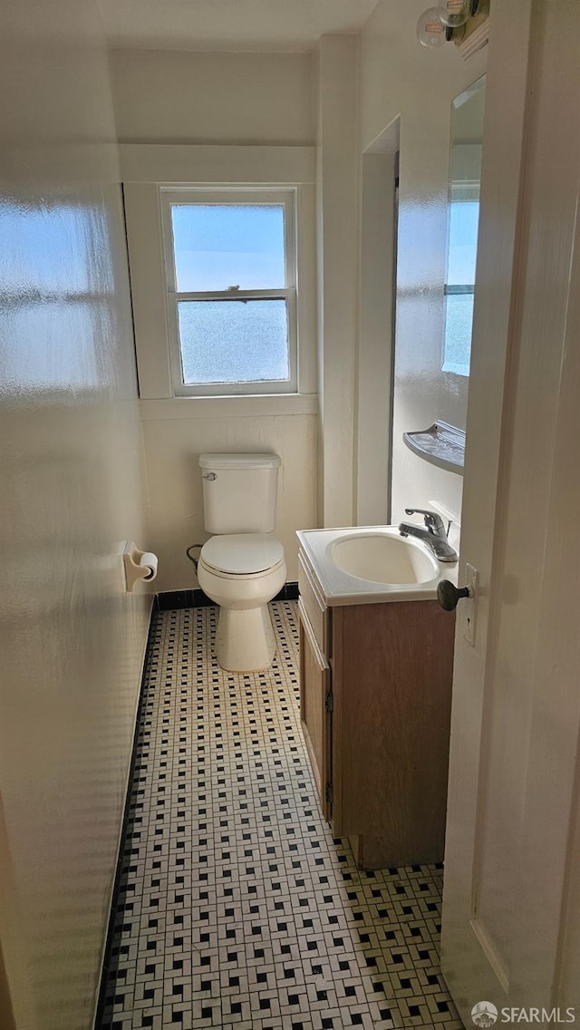 bathroom featuring vanity and toilet