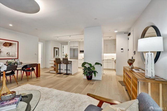 150 Eureka St, San Francisco, CA 94114 - living room with light wood-style flooring, rail lighting, baseboards, and recessed lighting