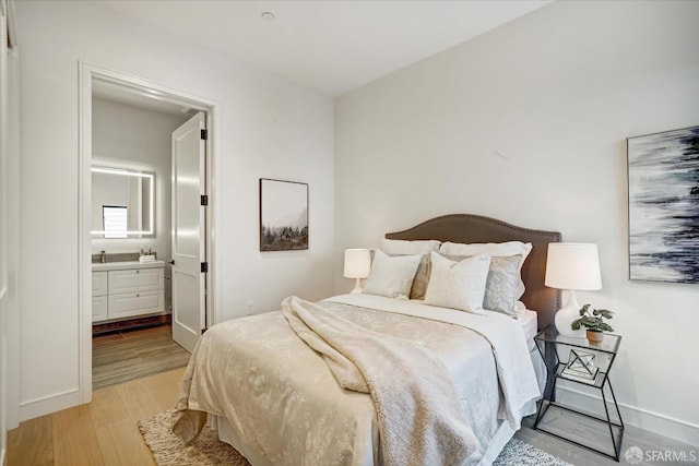 150 Eureka St, San Francisco, CA 94114 - bedroom featuring light wood-style floors, baseboards, and ensuite bath