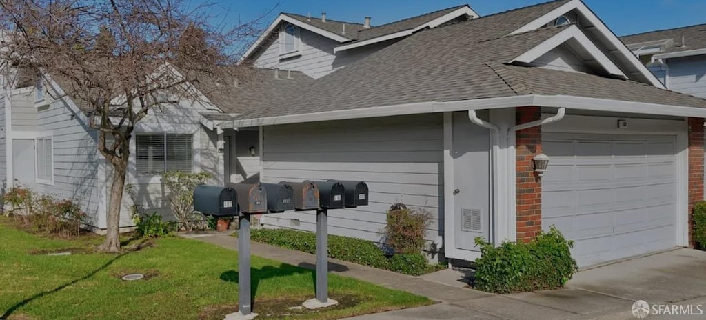 view of property exterior with concrete driveway, an attached garage, a yard, and a shingled roof