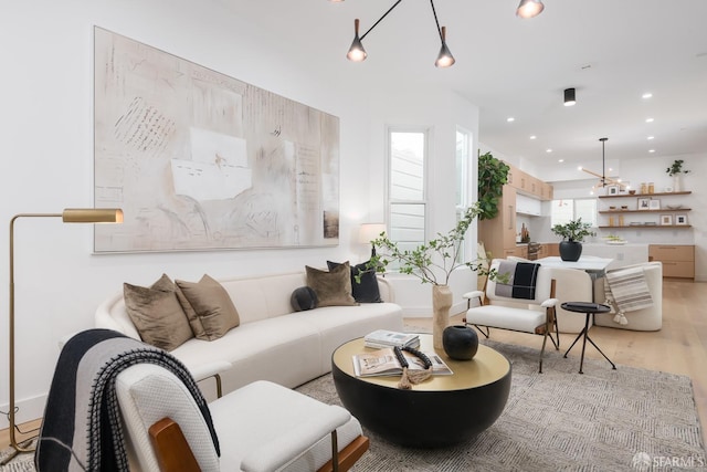 living area featuring recessed lighting and light wood-style floors