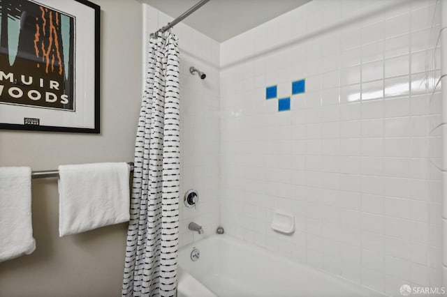 bathroom with shower / bath combination with curtain