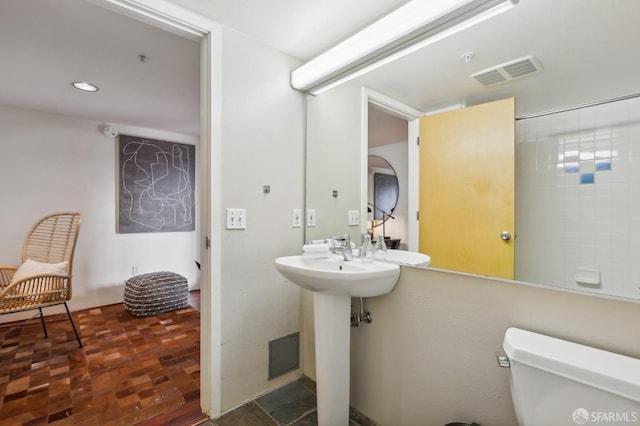 bathroom featuring toilet