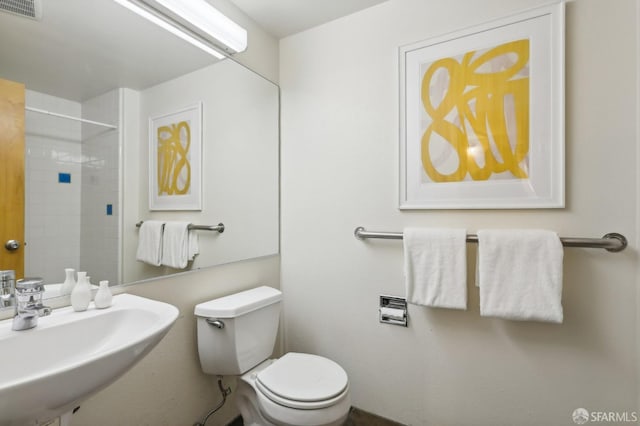 bathroom featuring toilet and sink